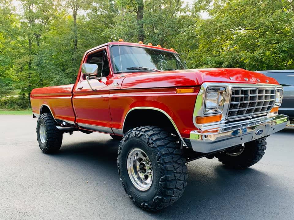 jacked up trucks red